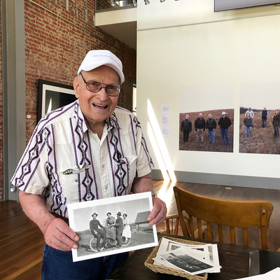 Robert Meseke with photo of his dad, aunts and uncle Otto Kratzer. Photo by Anne Gatschet